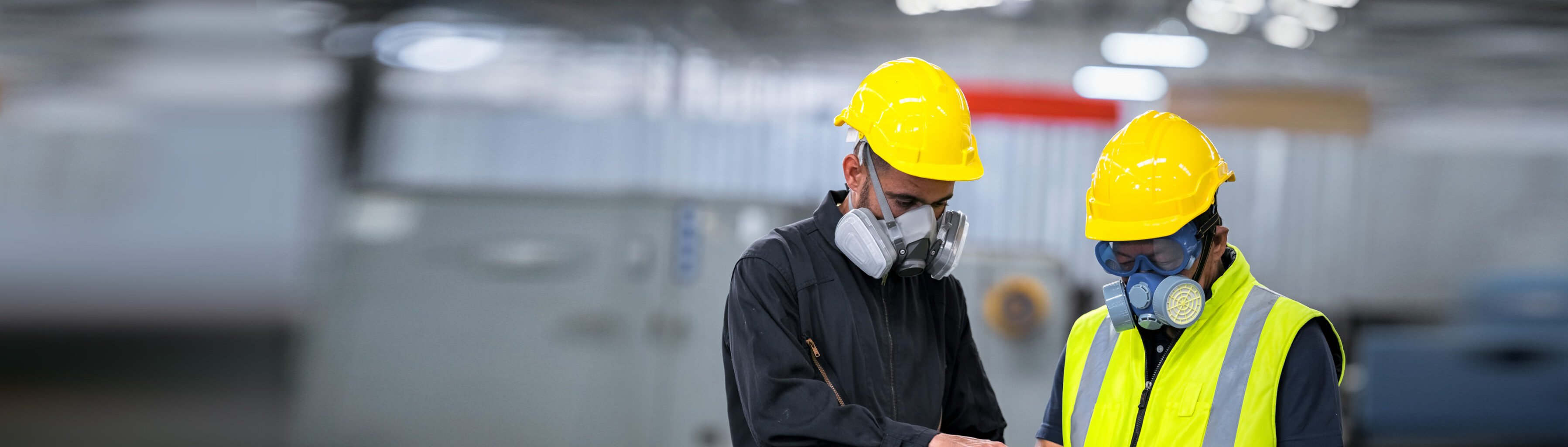 Two officers wearing gas masks, holding tablet and book, inspect the chemical spill site in an industrial warehouse to assess the damage, wearing gas masks, inspecting and evaluating toxicity of leak.