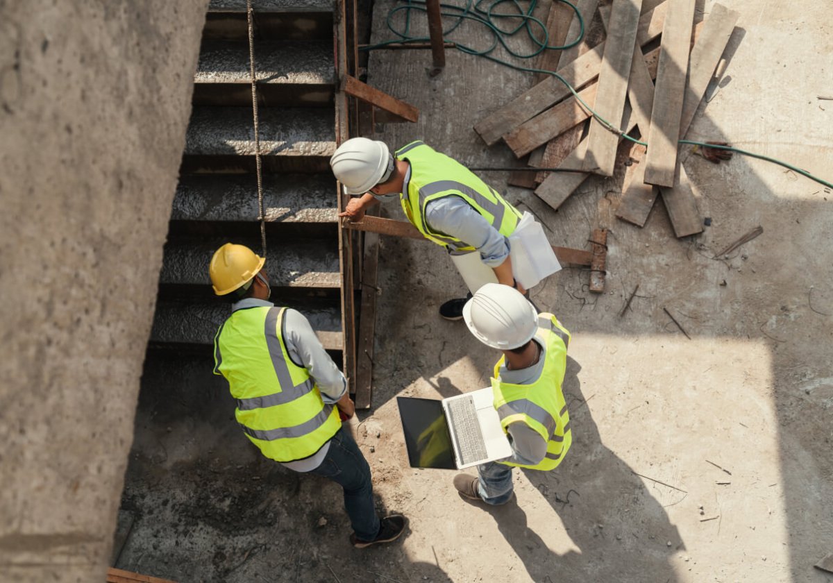 Top view, Team civil engineer inspection concrete pouring make stair at construction site. Building project with Civil Engineer, Contractor and Architect in construction site. Top view, Team civil engineer inspection concrete pouring make stair at construction site. Building project with Civil Engineer, Contractor and Architect in construction site.