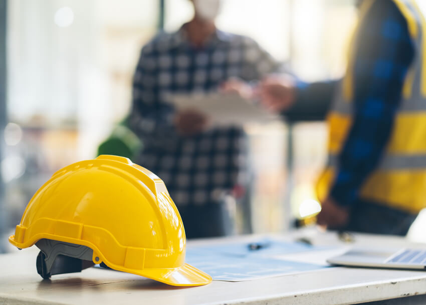 Concept architects, engineer holding pen pointing equipment architects On the desk with a blueprint in the office, engineers and architects brainstorm work on blueprints.