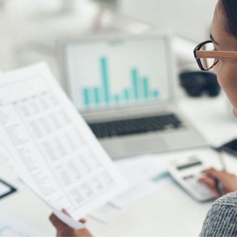 Women with glasses looking at stats