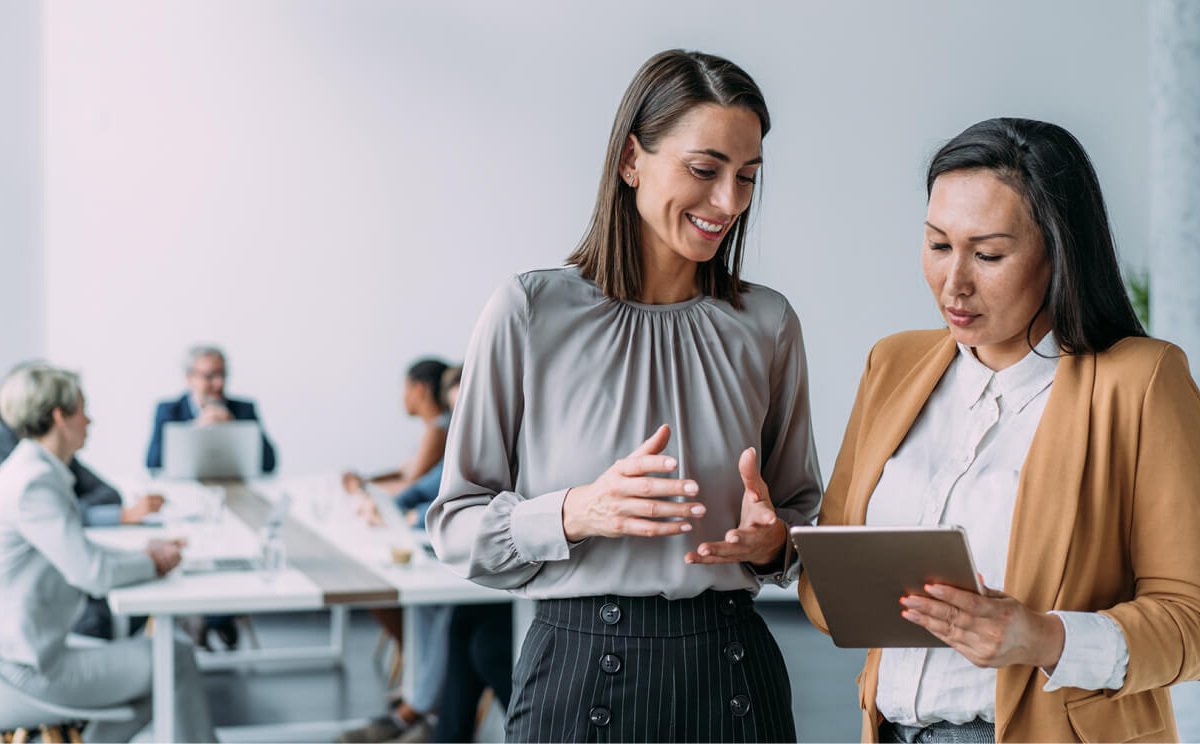 Business people in the office - two women Business people in the office - two women